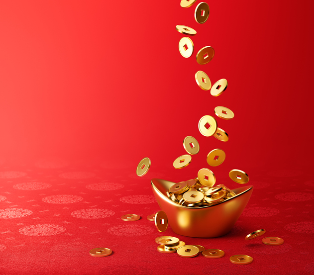 Gold coins getting poured into a gold dish with a red background.